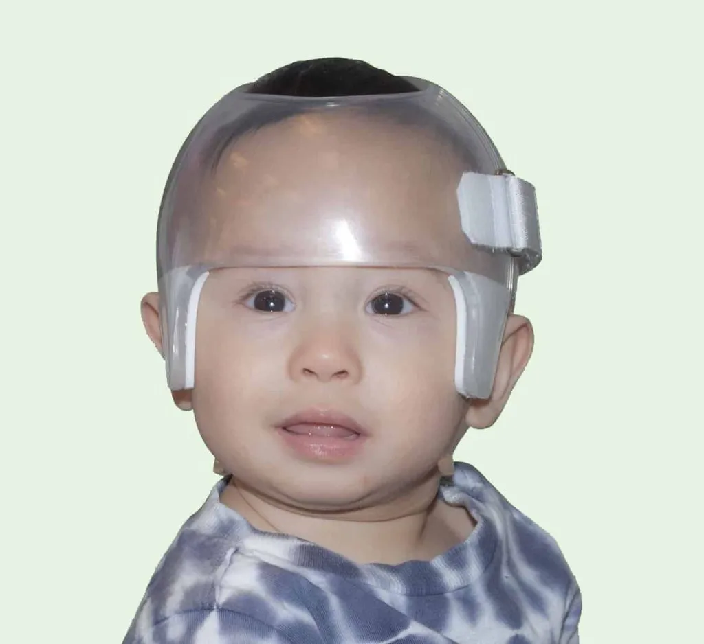 newborn wearing starlight side opening head shaper