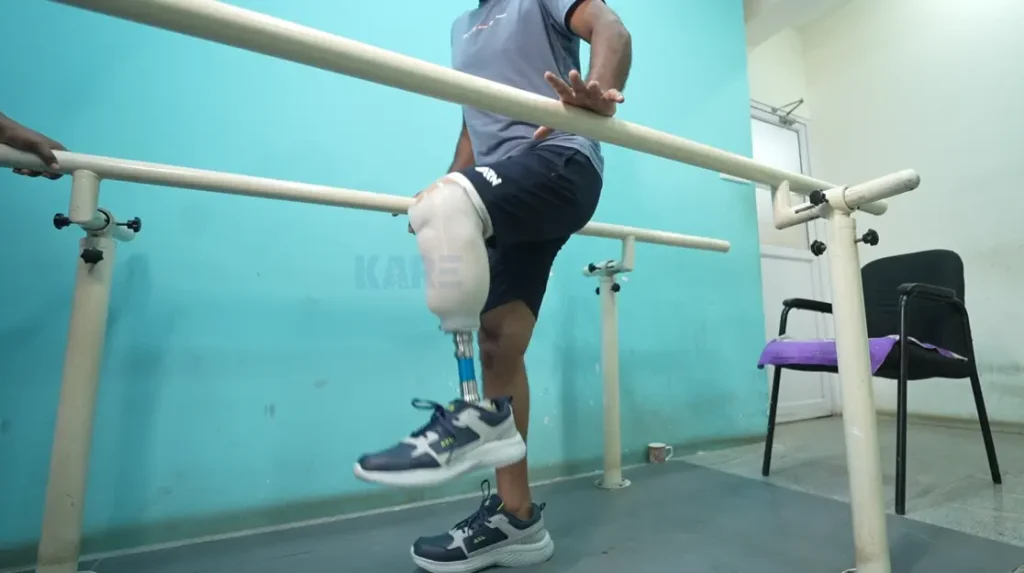 patient practicing gait training exercises with support to improve walking ability after amputation